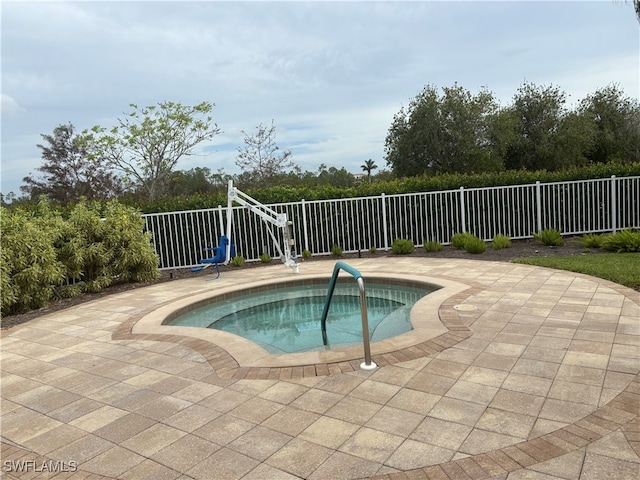 view of swimming pool with a patio