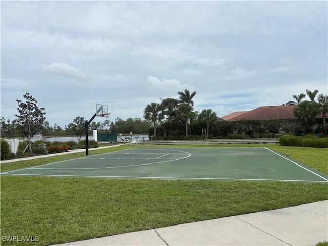 view of sport court featuring a yard