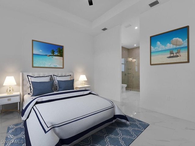 bedroom with ceiling fan and ensuite bath