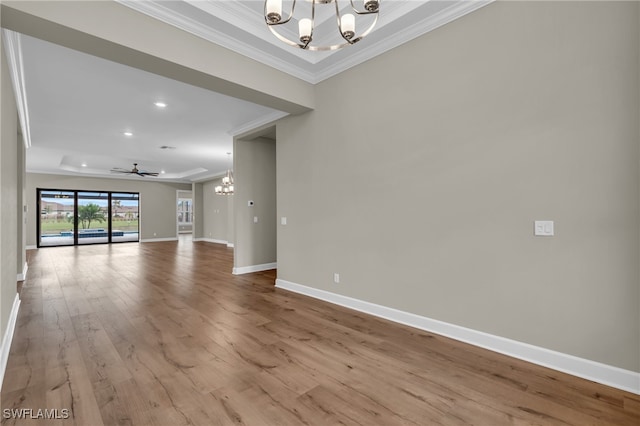 interior space featuring crown molding, light hardwood / wood-style flooring, and ceiling fan with notable chandelier