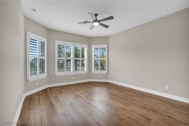 empty room featuring ceiling fan and light wood-type flooring