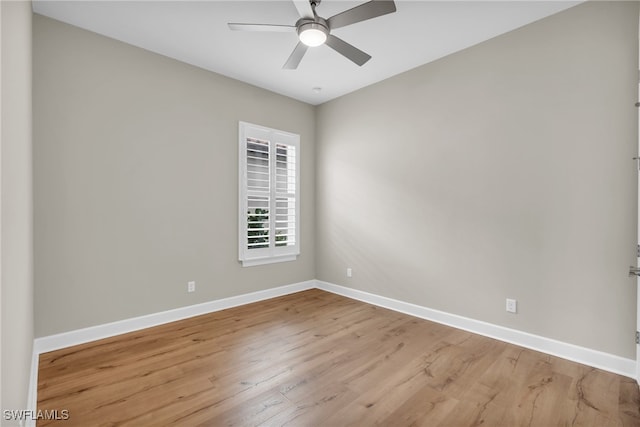 empty room with ceiling fan and light wood-type flooring