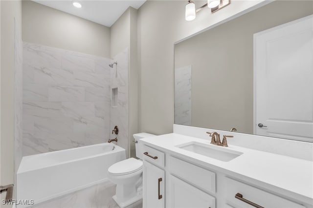 full bathroom featuring vanity, tiled shower / bath combo, and toilet