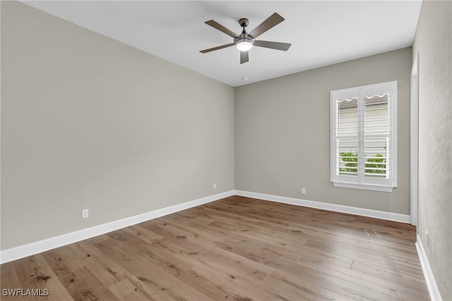 spare room featuring ceiling fan and light wood-type flooring