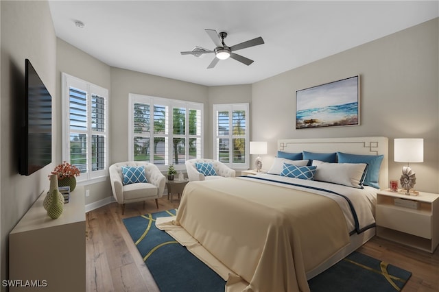 bedroom featuring ceiling fan and hardwood / wood-style flooring