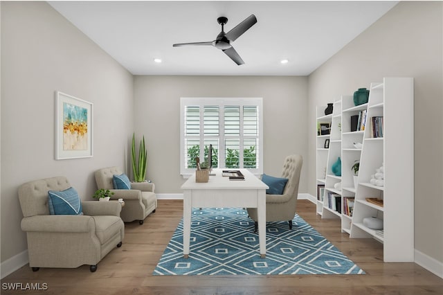 office space featuring light hardwood / wood-style floors and ceiling fan