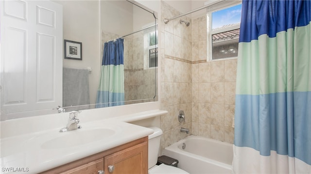 full bathroom featuring toilet, shower / bathtub combination with curtain, and vanity