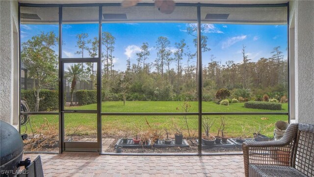 unfurnished sunroom with a healthy amount of sunlight