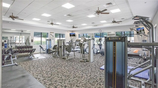 gym featuring a paneled ceiling