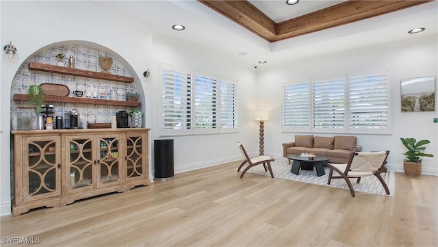 sitting room with a healthy amount of sunlight and light hardwood / wood-style floors