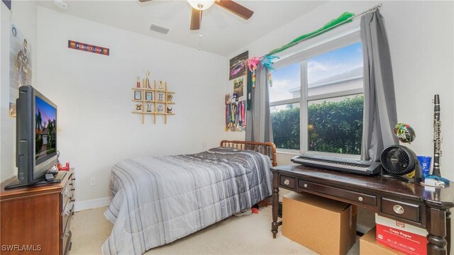 bedroom featuring ceiling fan and multiple windows