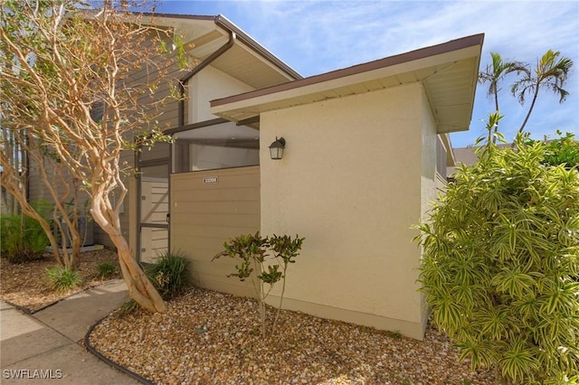 13366 Fox Chapel Ct, Fort Myers, FL 33919 - view of property exterior with stucco siding