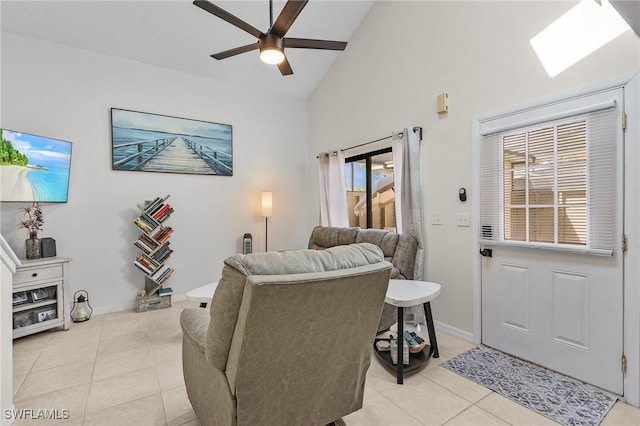 living room with high vaulted ceiling, light tile patterned floors, and ceiling fan