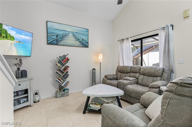 tiled living room featuring high vaulted ceiling