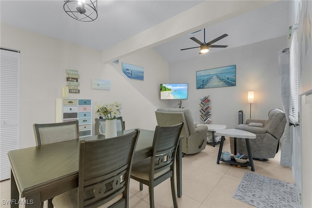 dining space featuring vaulted ceiling with beams, ceiling fan, and light tile patterned floors