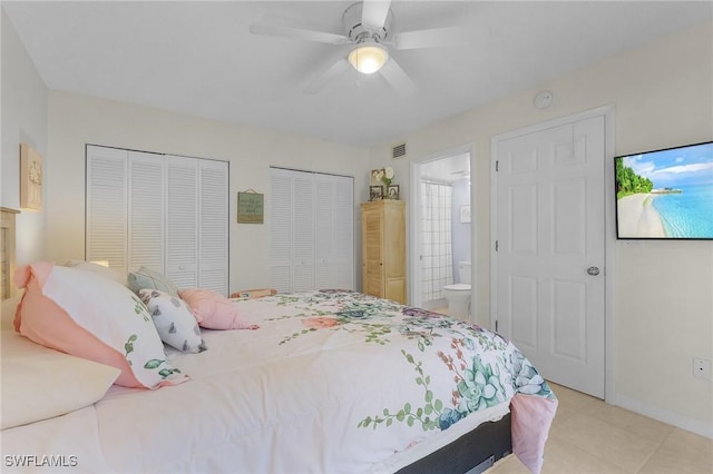 13366 Fox Chapel Ct, Fort Myers, FL 33919 - bedroom featuring multiple closets, light tile patterned floors, a ceiling fan, and ensuite bathroom