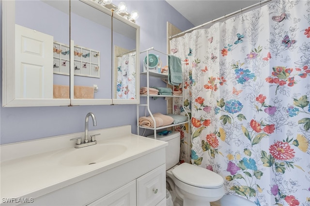 bathroom with vanity and toilet