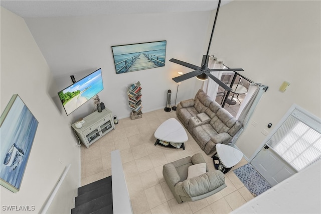 living room with high vaulted ceiling, tile patterned floors, and ceiling fan