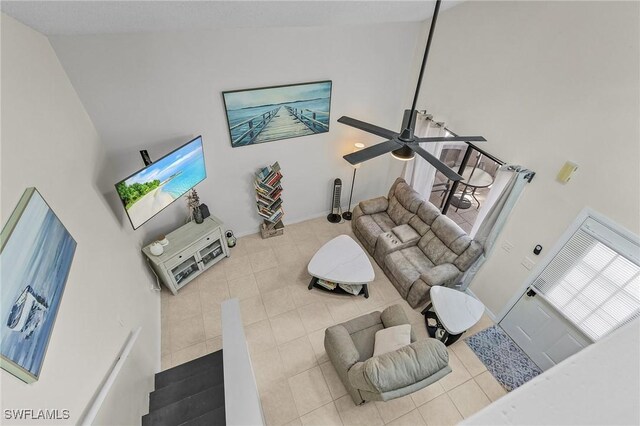 13366 Fox Chapel Ct, Fort Myers, FL 33919 - living room featuring tile patterned flooring, a ceiling fan, and high vaulted ceiling