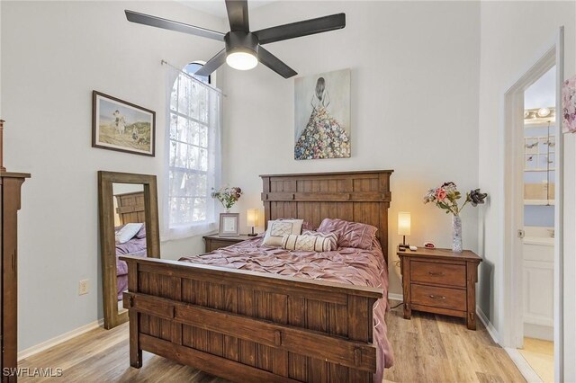 13366 Fox Chapel Ct, Fort Myers, FL 33919 - bedroom with light wood-style floors, a ceiling fan, and ensuite bath