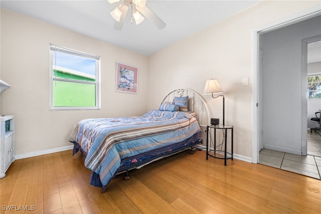 bedroom featuring ceiling fan and light hardwood / wood-style flooring