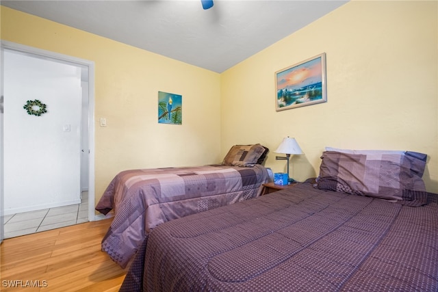 bedroom with hardwood / wood-style flooring and ceiling fan