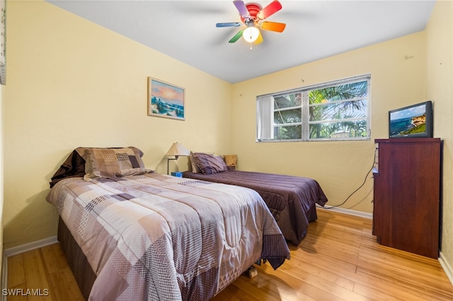 bedroom featuring ceiling fan and light hardwood / wood-style flooring