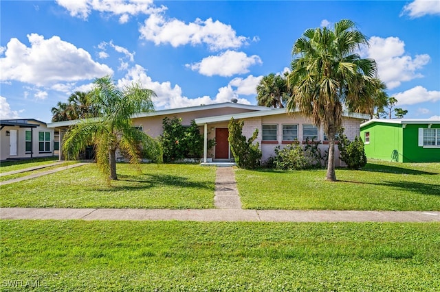 single story home featuring a front lawn