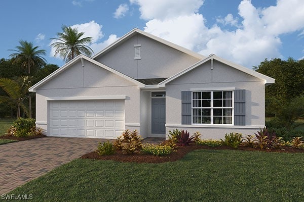 view of front of house featuring a garage and a front lawn