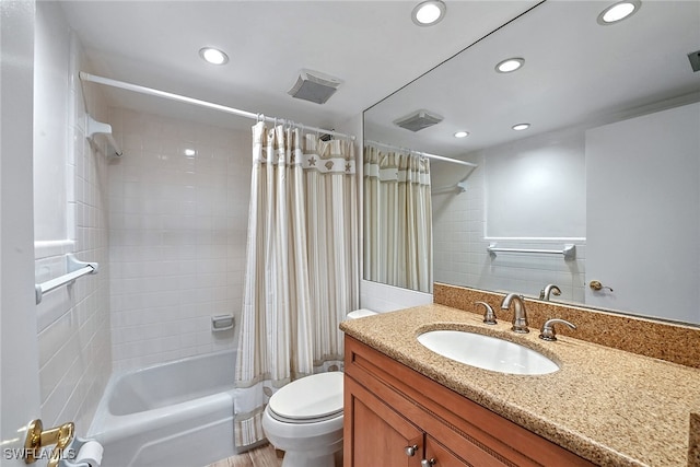 full bathroom with toilet, vanity, hardwood / wood-style flooring, and shower / bathtub combination with curtain