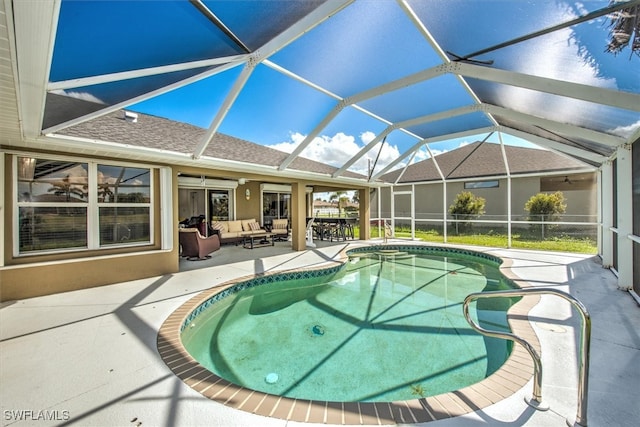 view of pool with a lanai, an outdoor hangout area, and a patio