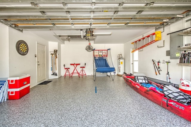 garage with electric water heater and a garage door opener