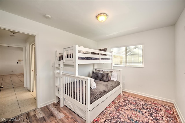 bedroom with hardwood / wood-style flooring