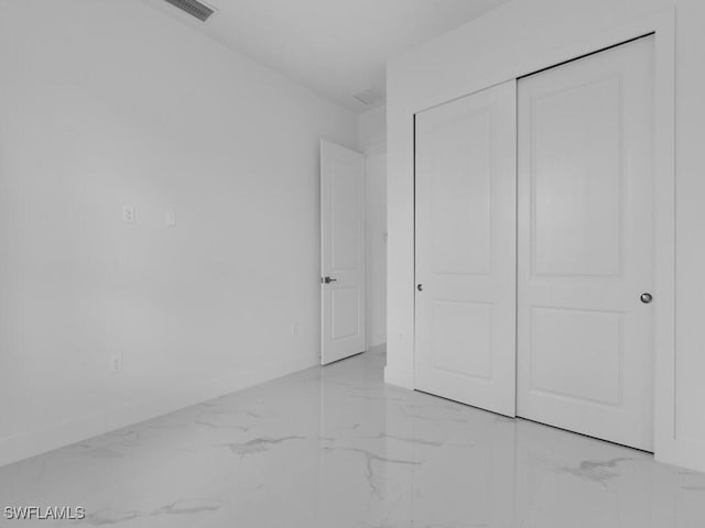 unfurnished bedroom with a closet