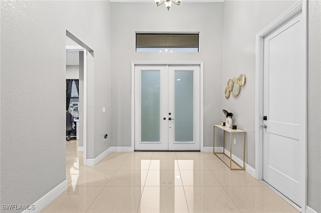 tiled foyer entrance with french doors