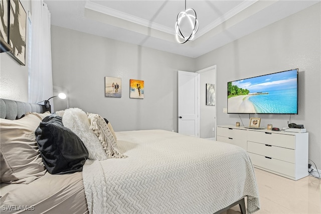 bedroom with crown molding and a tray ceiling