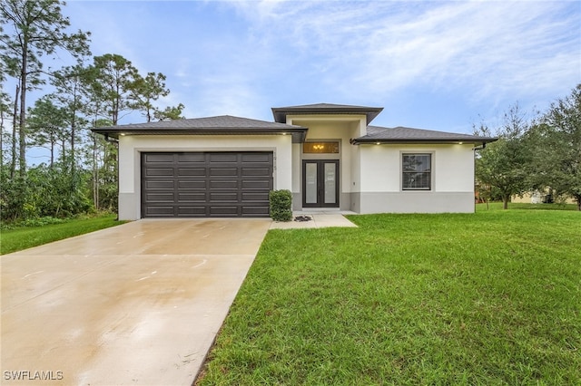 prairie-style house with a garage and a front yard