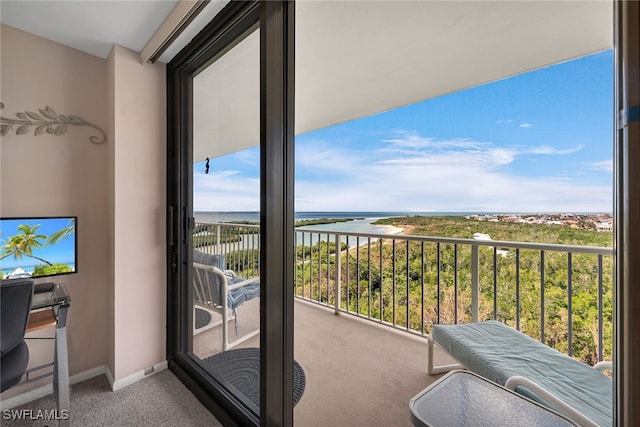 balcony featuring a water view