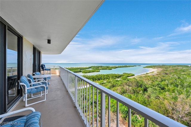 balcony featuring a water view