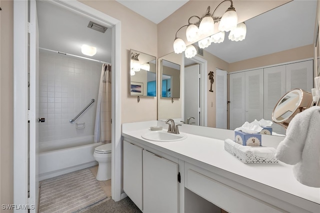 full bathroom featuring tile patterned flooring, vanity, toilet, and shower / tub combo with curtain