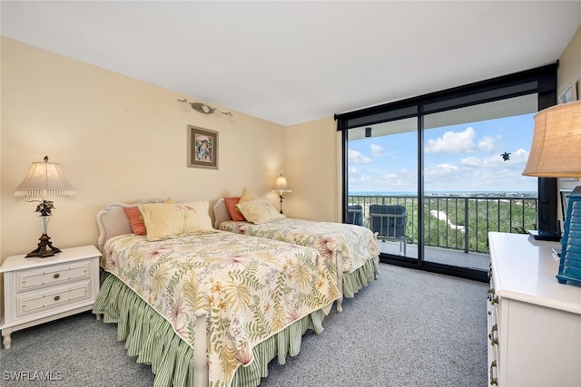 carpeted bedroom featuring access to exterior and floor to ceiling windows