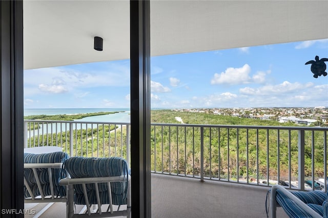 balcony featuring a water view