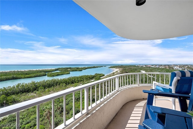 balcony featuring a water view