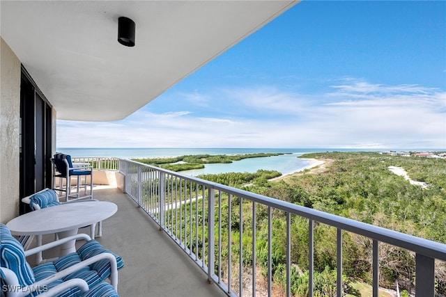 balcony featuring a water view