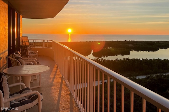 balcony at dusk with a water view