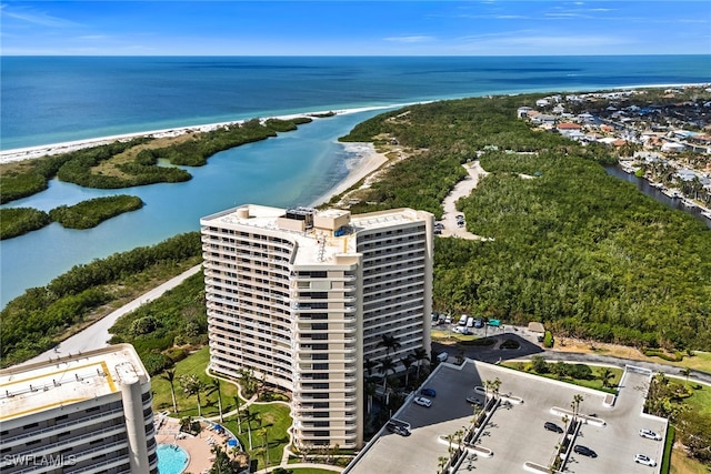 aerial view with a water view and a view of the beach