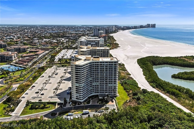 birds eye view of property featuring a water view and a view of the beach