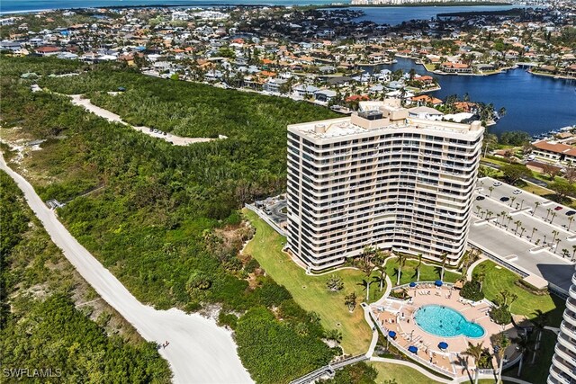 birds eye view of property with a water view