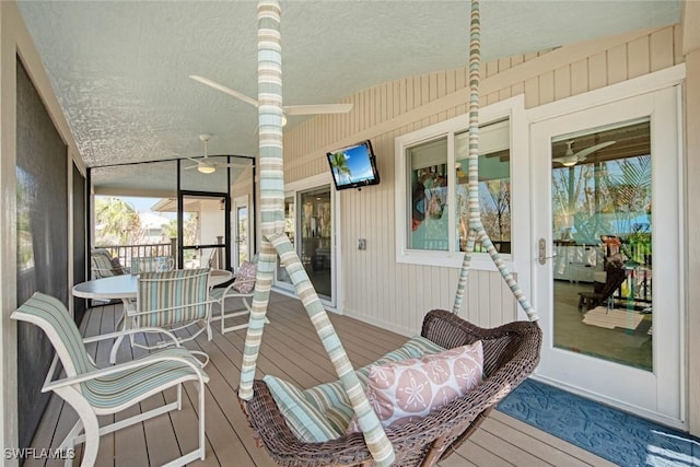 wooden terrace with ceiling fan