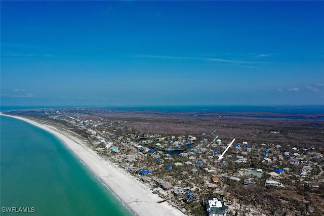 aerial view with a water view and a view of the beach